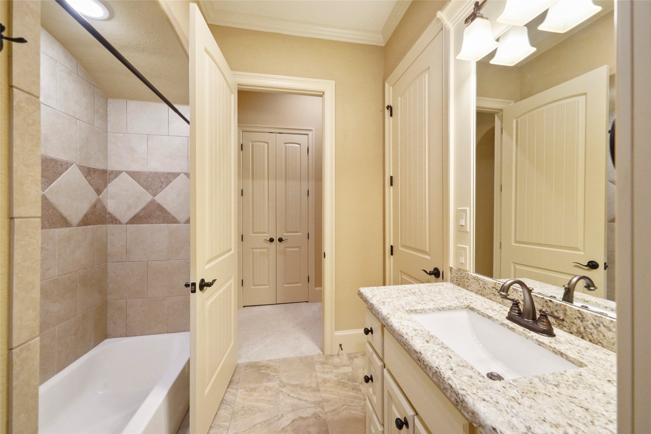 18 Rugged Lark Circle Tomball, TX 77377 - Photo 37 of 50 Both upstairs bedrooms have ensuite bathrooms. Baths and closets have built ins.