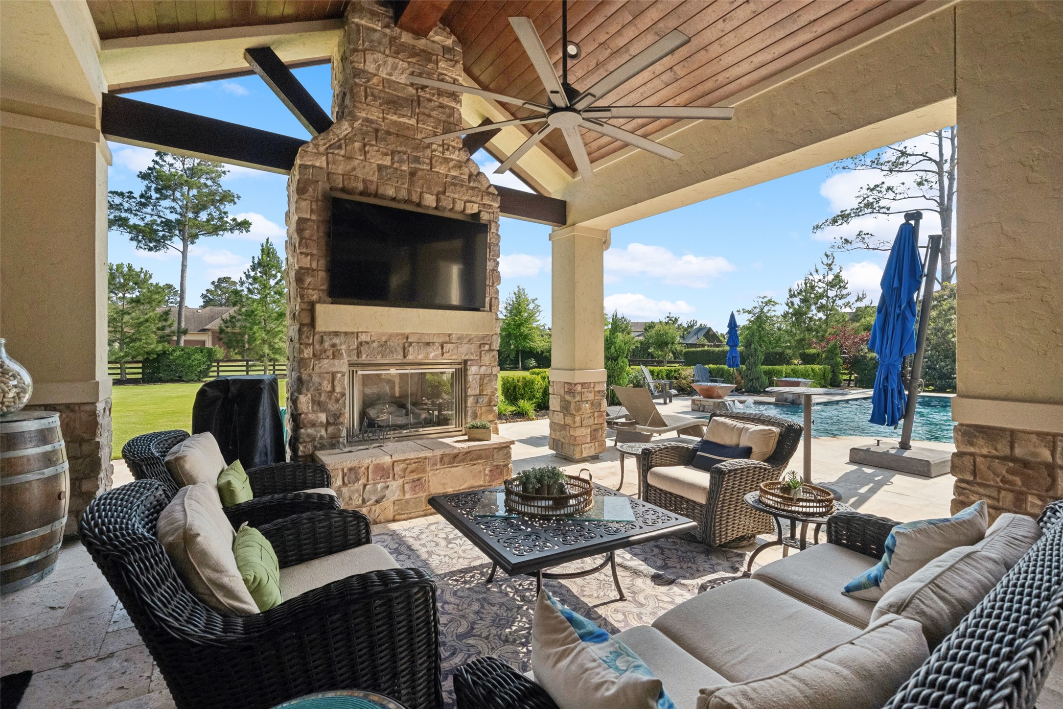 18 Rugged Lark Circle Tomball, TX 77377 - Photo 42 of 50 Welcome to your own outdoor Paradise complete with Fireplace, wired for tv & sound system, ceiling fans and lots of space to entertain. Backyard is extensively landscaped with privacy in mind.