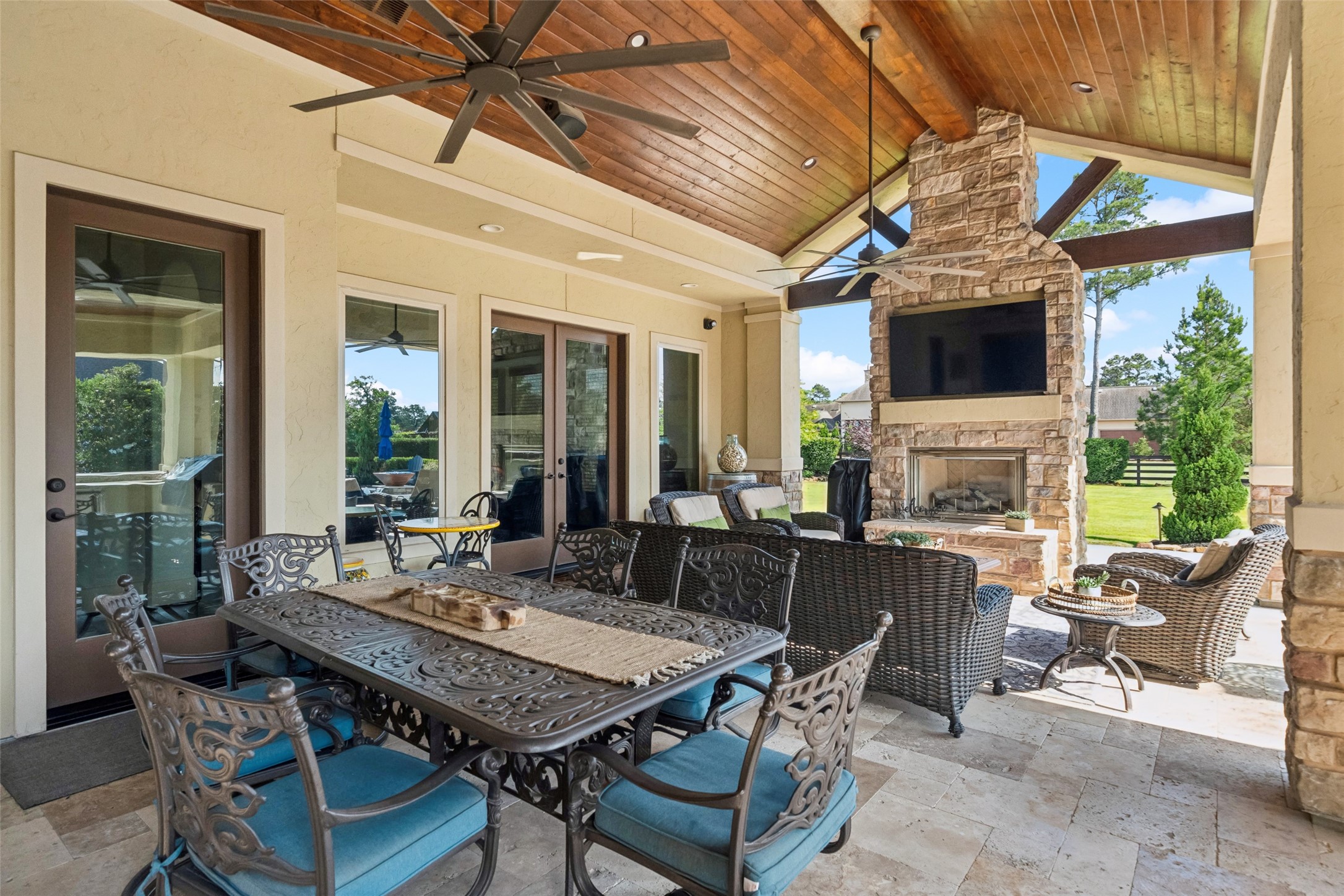 18 Rugged Lark Circle Tomball, TX 77377 - Photo 43 of 50 Large space with access from the gameroom and hall outside the guest bedroom. Recessed lighting and wooden ceiling, travertine flooring all add to the luxury of this space.