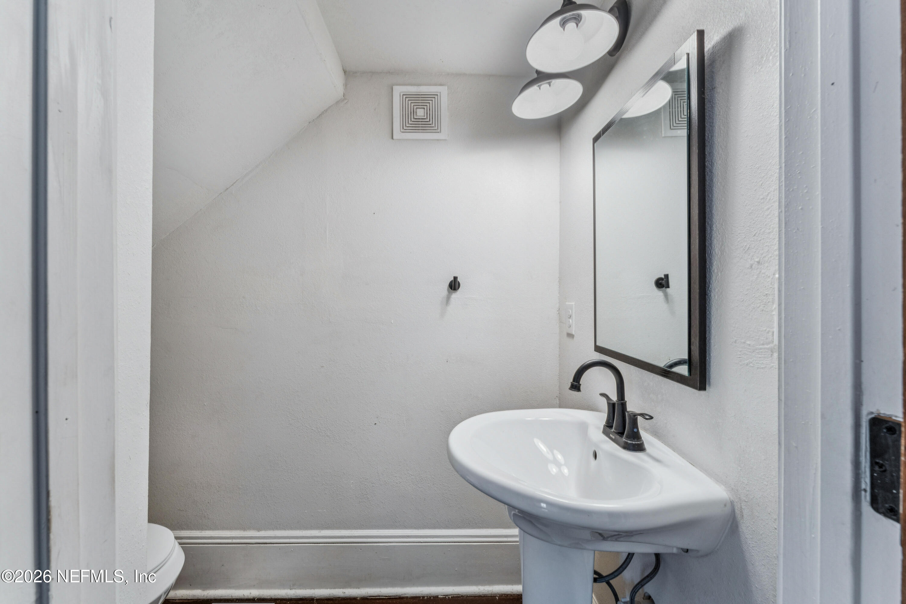 1625 Perry Street Jacksonville, FL 32206 - Photo 21 of 36 a bathroom with a sink and a mirror