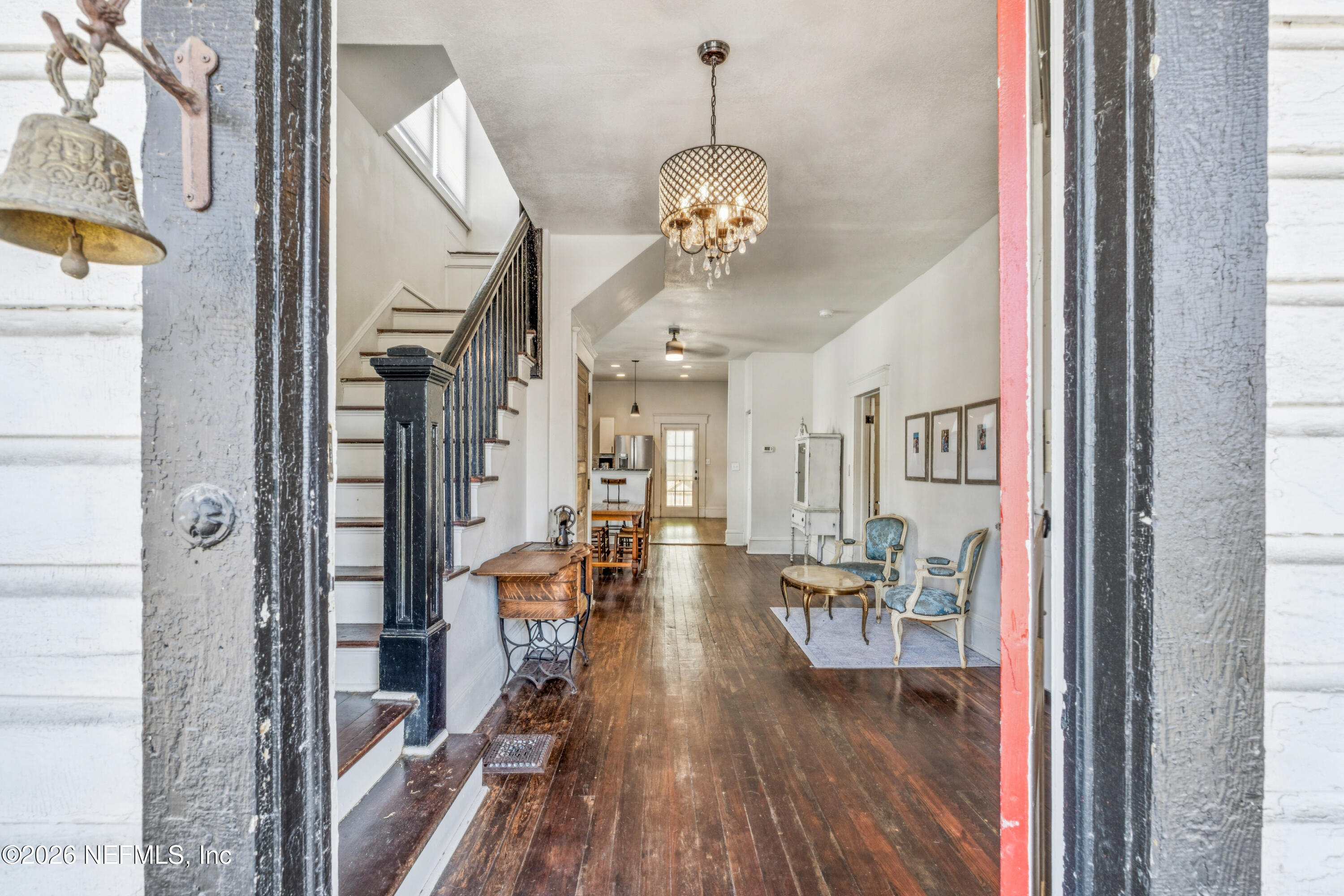 1625 Perry Street Jacksonville, FL 32206 - Photo 3 of 36 a view of a dining room with furniture wooden floor and a chandelier