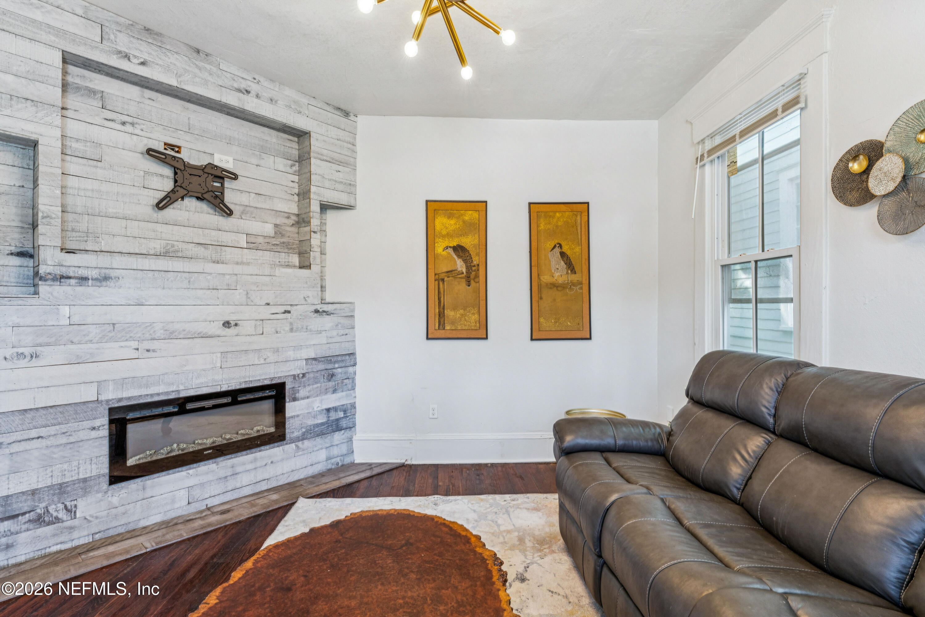 1625 Perry Street Jacksonville, FL 32206 - Photo 5 of 36 a living room with furniture and a fireplace