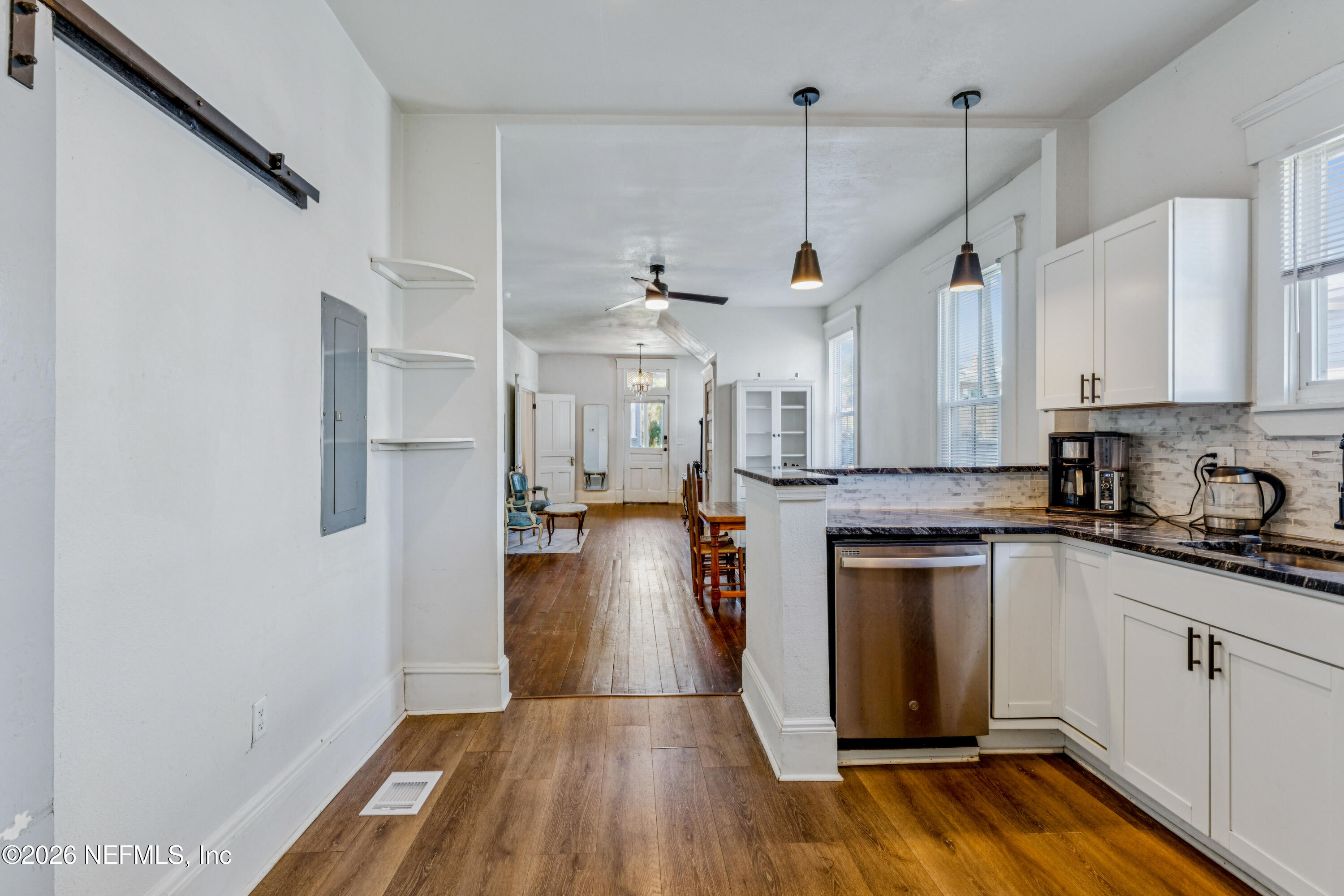 1625 Perry Street Jacksonville, FL 32206 - Photo 9 of 36 a kitchen with a refrigerator and white cabinets