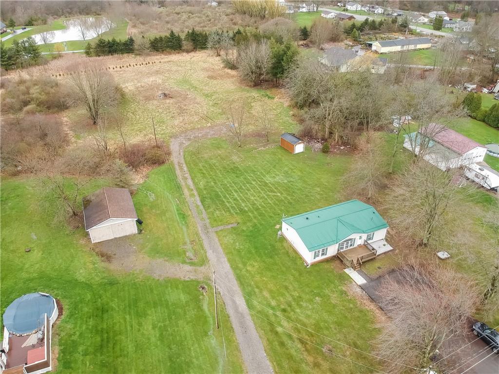 140 McCaslin Road New Castle, PA 16101 - Photo 2 of 28 a view of a lake with a yard