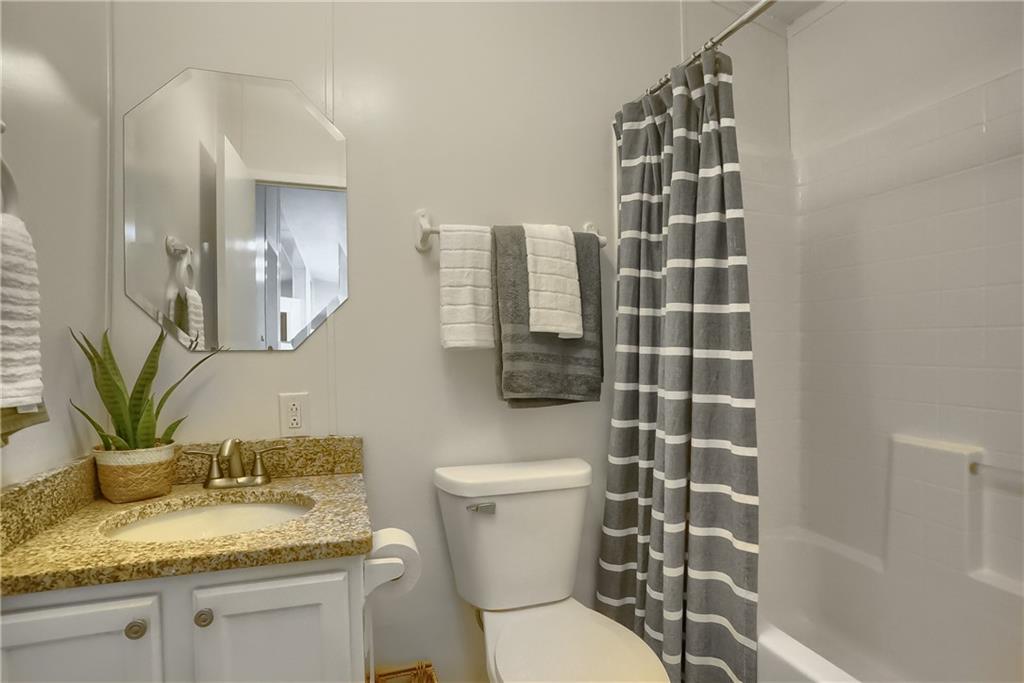 140 McCaslin Road New Castle, PA 16101 - Photo 21 of 28 a bathroom with a granite countertop sink a toilet and a mirror