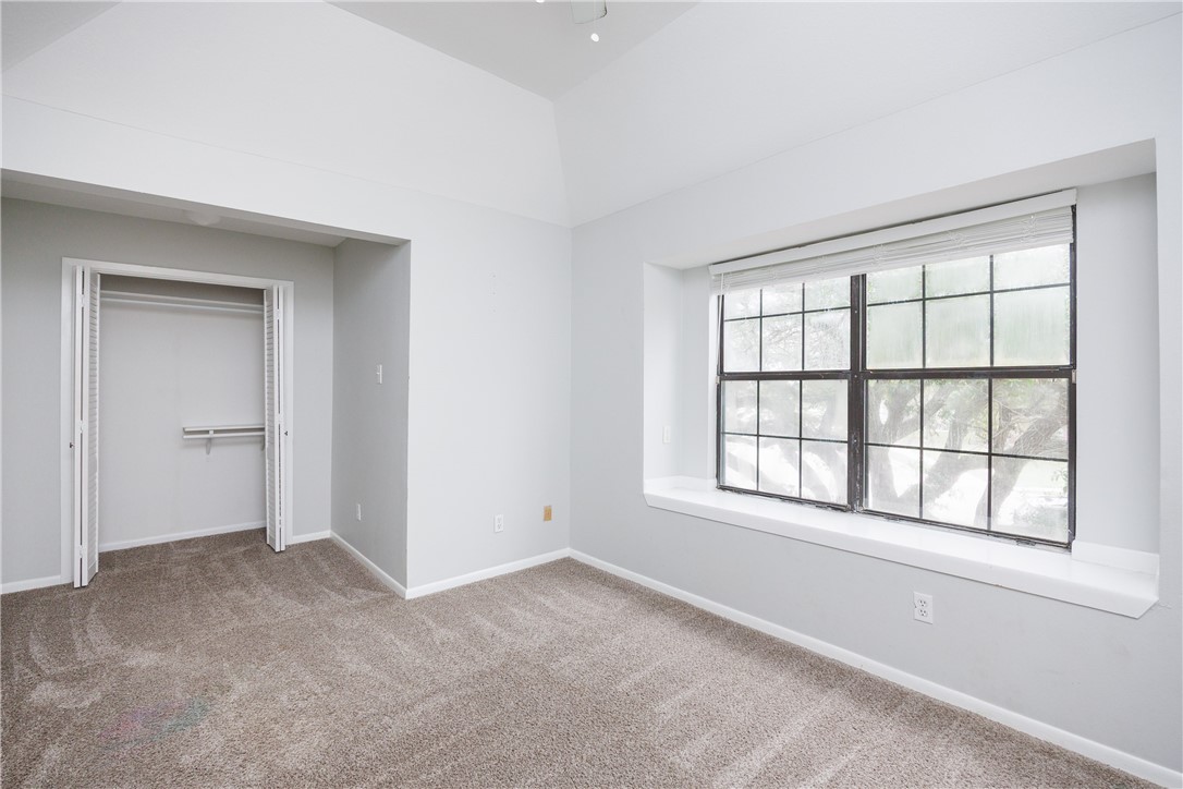 320 Long Point Drive Portland, TX 78374 - Photo 11 of 40 Vaulted ceiling room featuring a large window with
