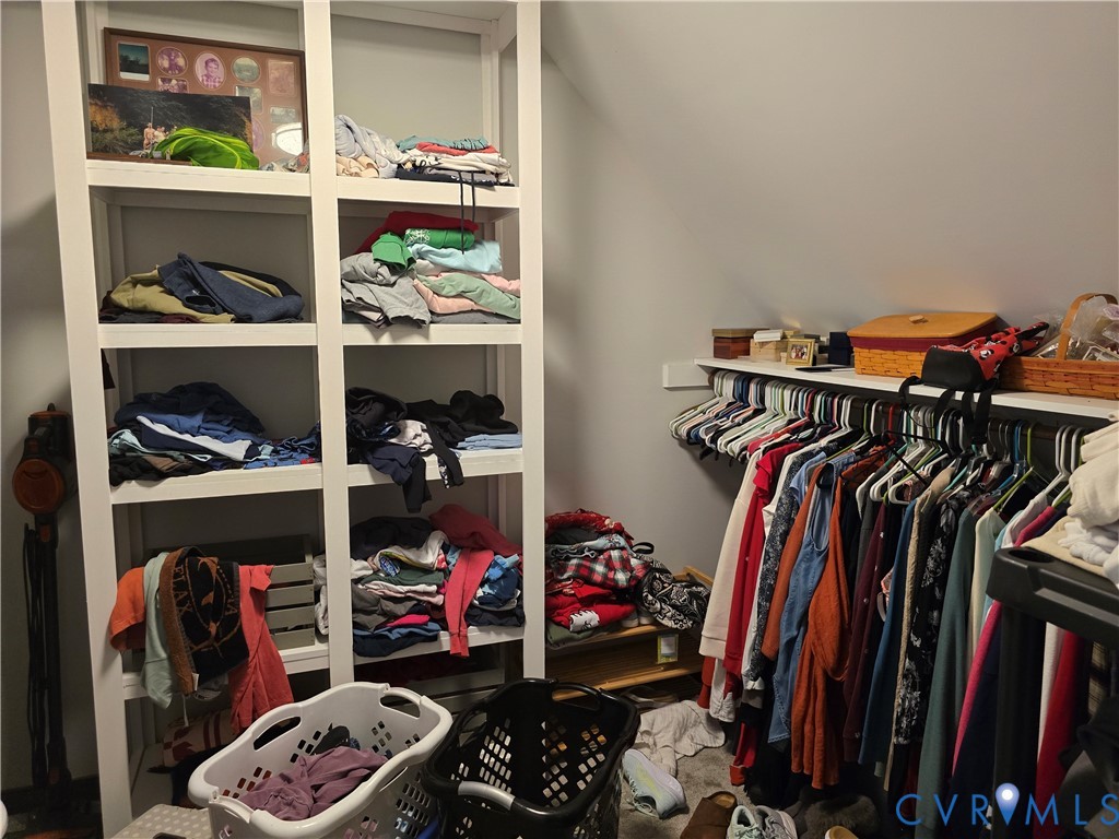 13305 Pointer Ridge Terrace Midlothian, VA 23112 - Photo 9 of 24 a view of walk in closet with clothes and shoes