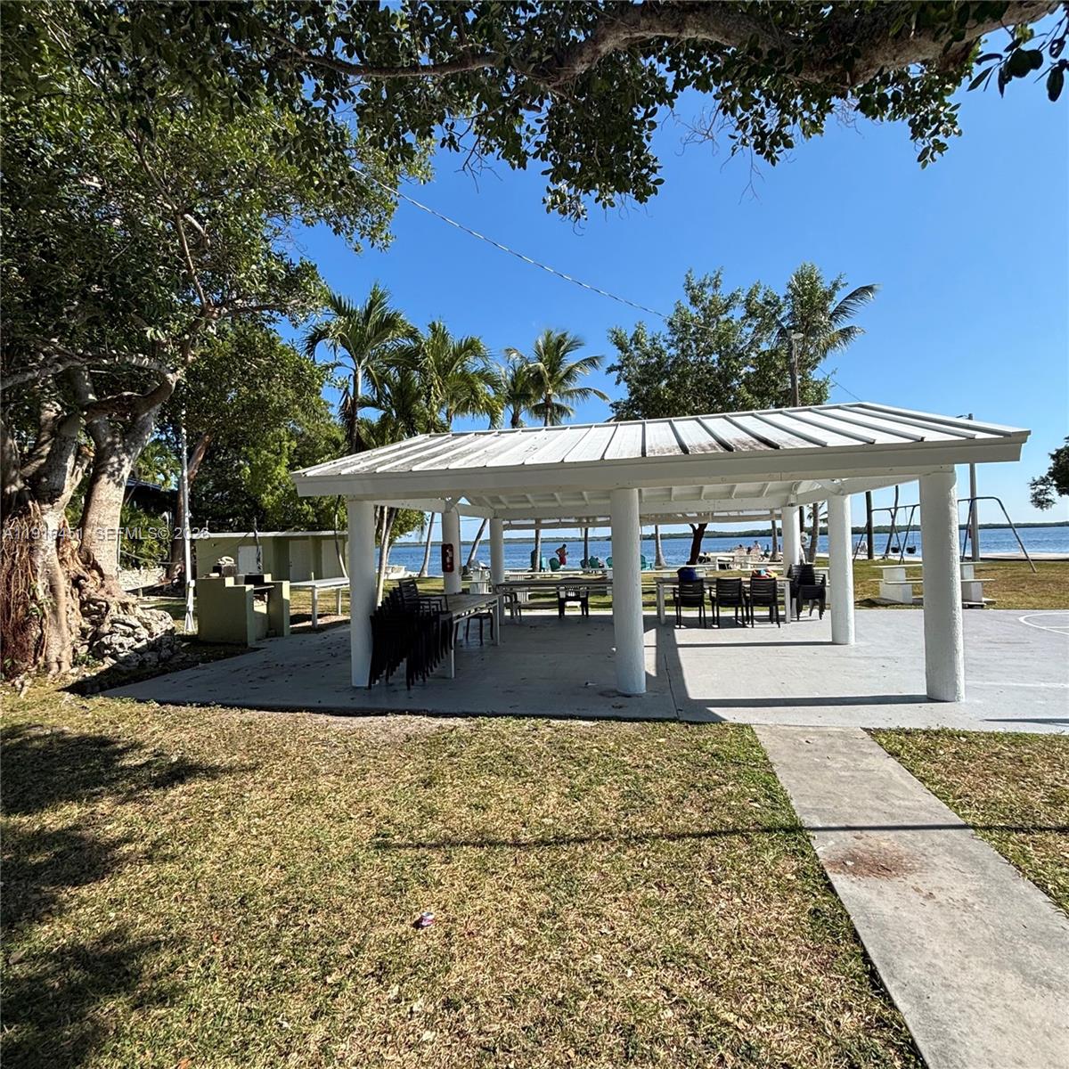 63 Bass Avenue, Unit 2 Key Largo, FL 33037 - Photo 15 of 24 a view of a house with a yard