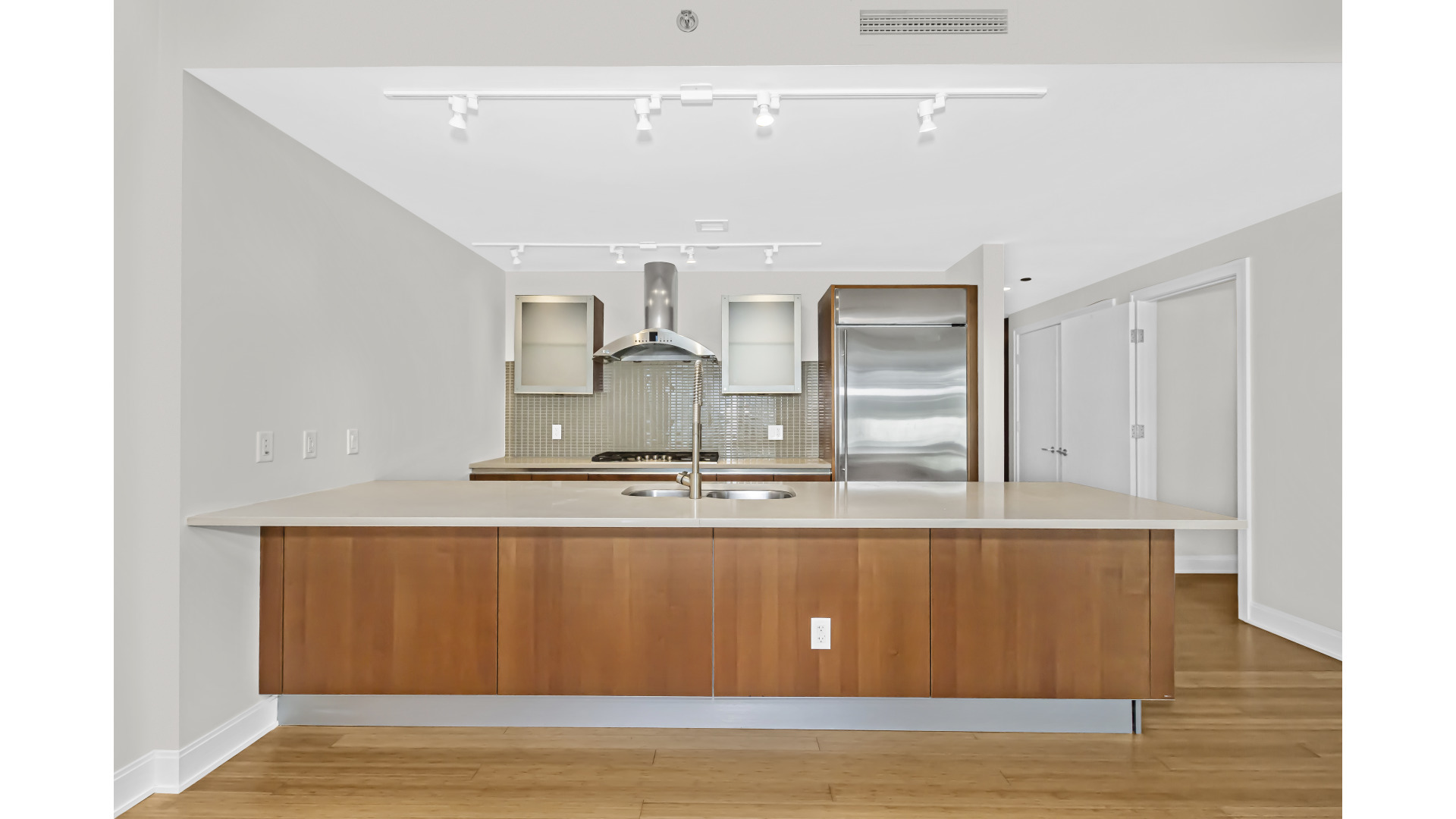 340 East Randolph Street, Unit 404 Chicago, IL 60601 - Photo 6 of 20 a view of kitchen with wooden floor