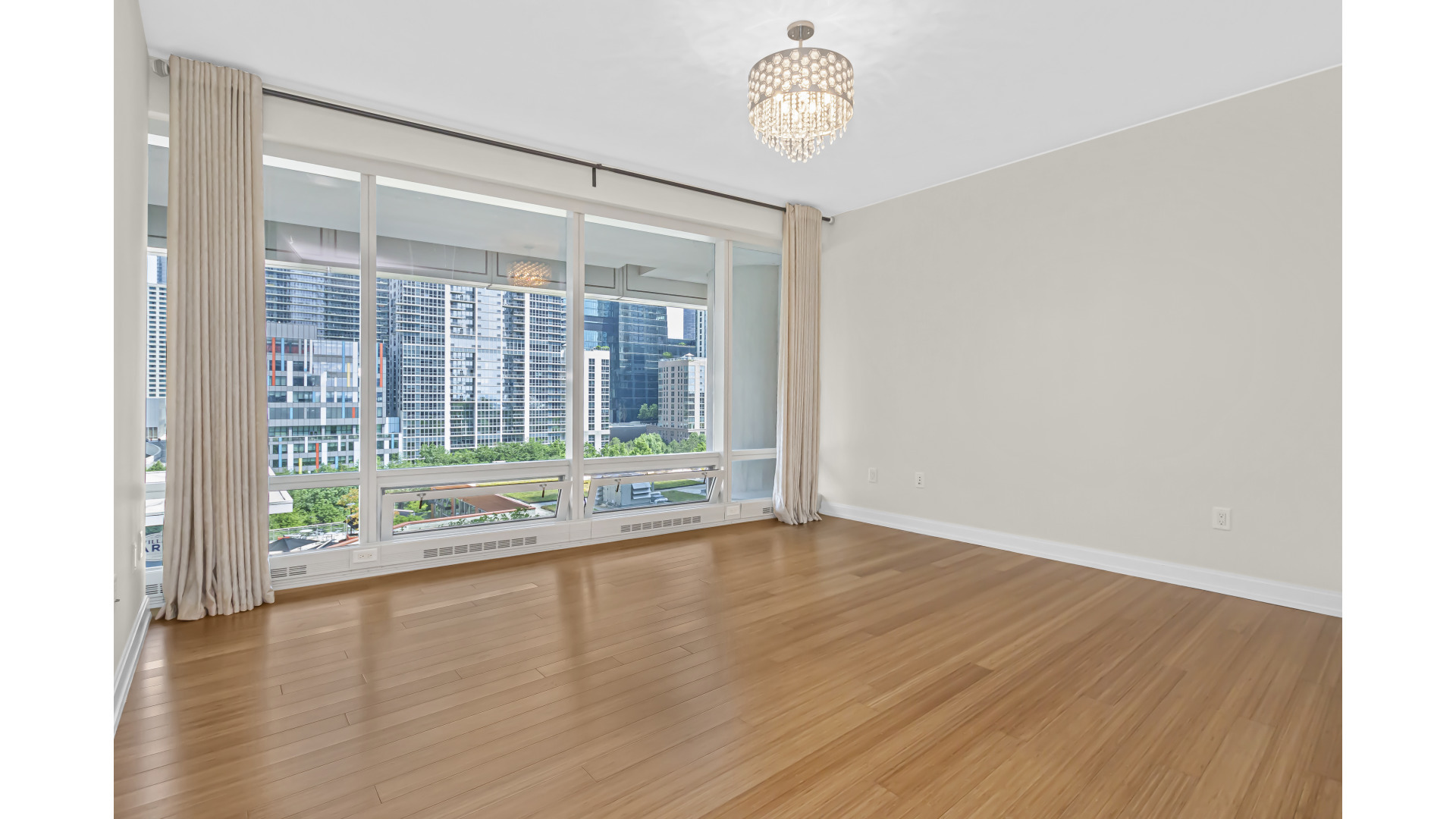 340 East Randolph Street, Unit 404 Chicago, IL 60601 - Photo 9 of 20 a view of an empty room with a window