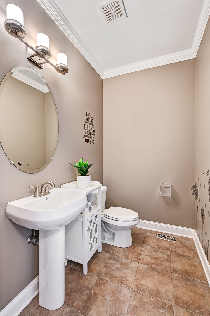 14951 South Preserve Drive Lockport, IL 60441 - Photo 12 of 25 a bathroom with a sink toilet and mirror