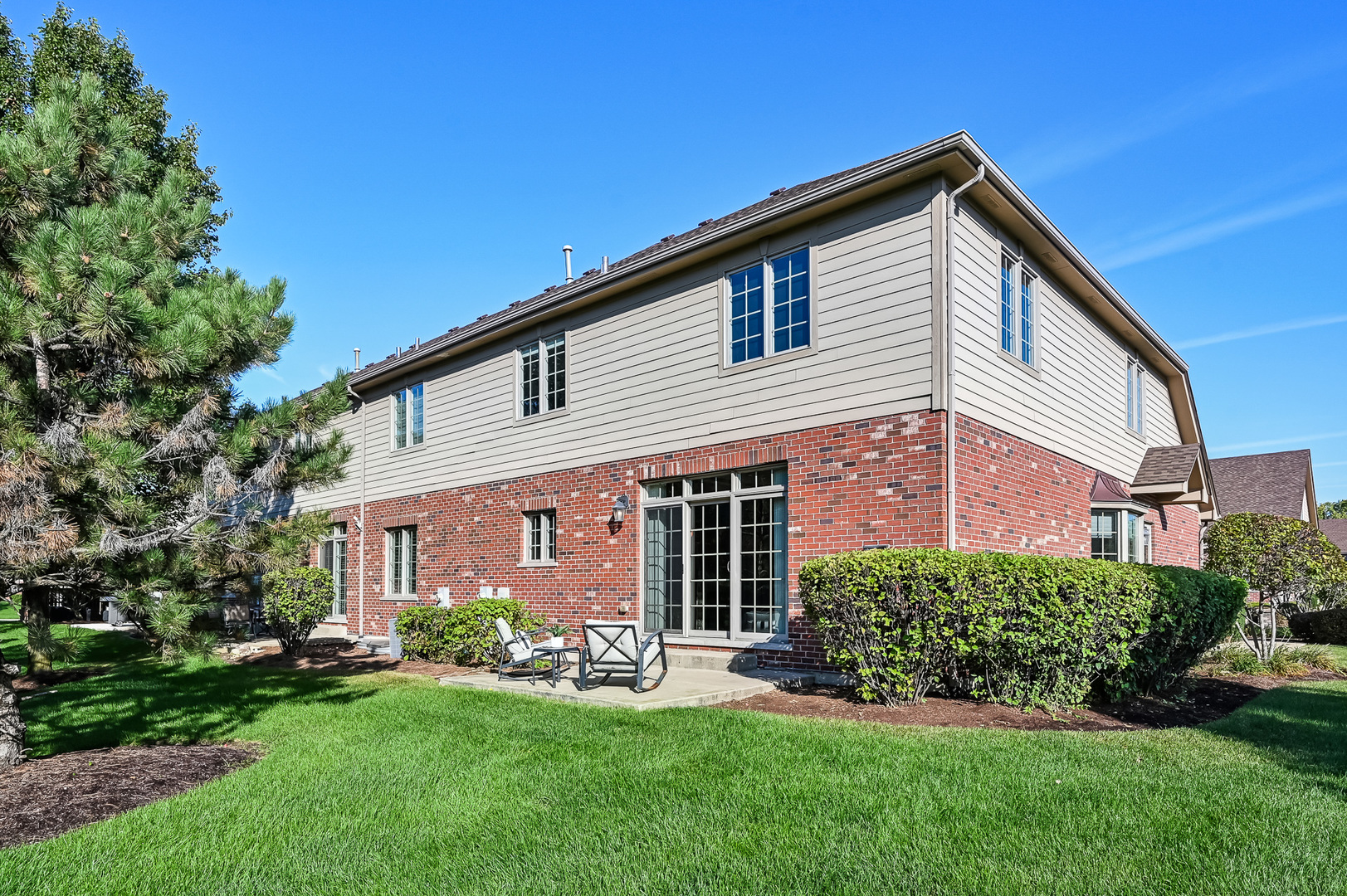 14951 South Preserve Drive Lockport, IL 60441 - Photo 4 of 25 a front view of a house with a yard and porch