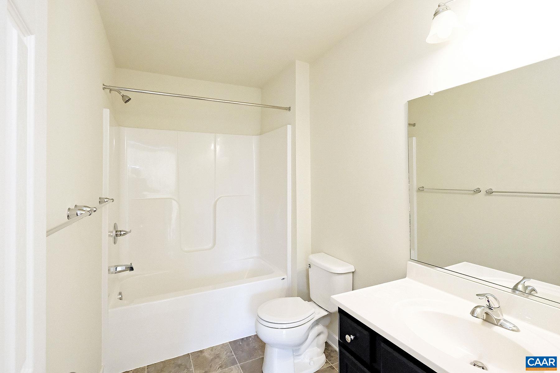 115 Reedy Creek Road Louisa, VA 23093 - Photo 12 of 17 a bathroom with a sink a toilet and shower