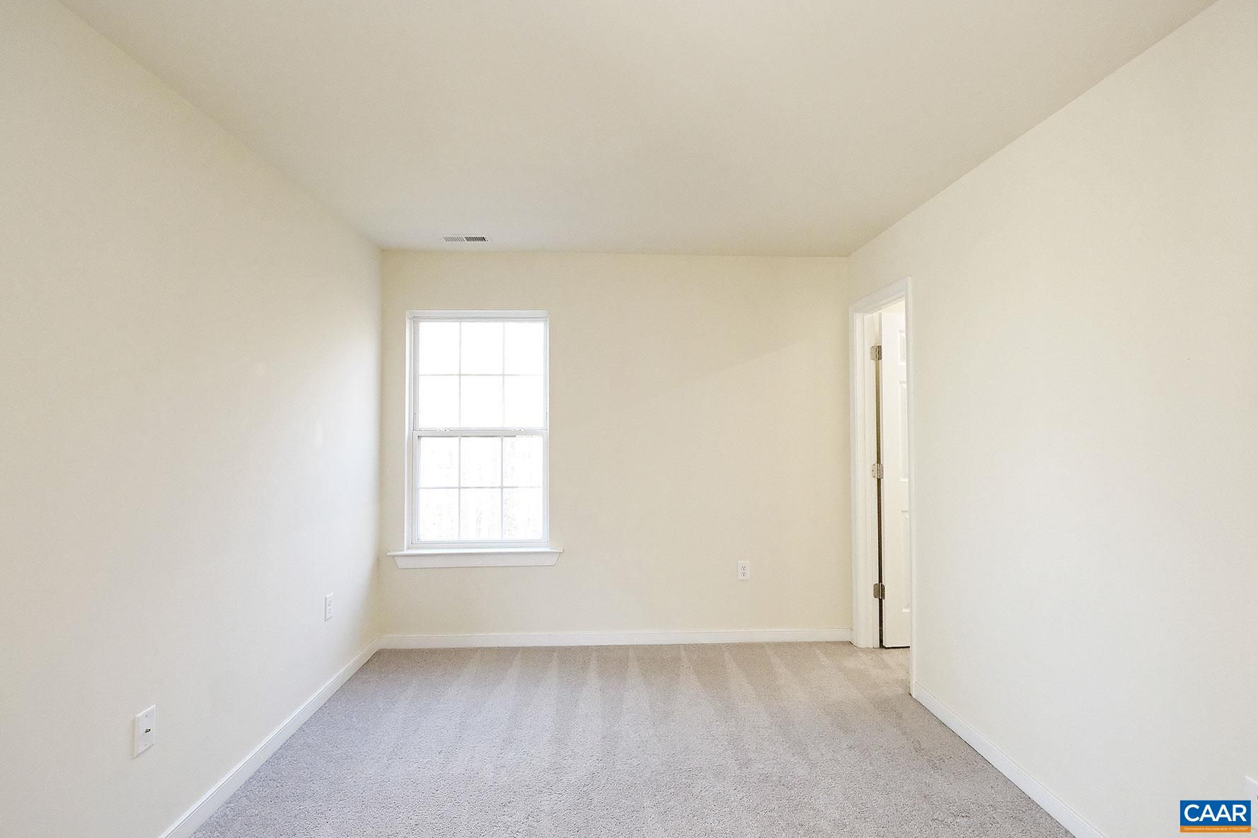 115 Reedy Creek Road Louisa, VA 23093 - Photo 14 of 17 an empty room with windows