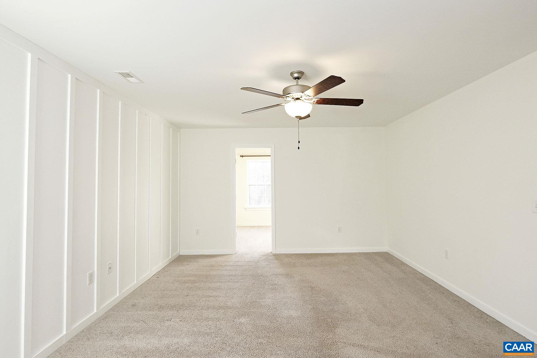 115 Reedy Creek Road Louisa, VA 23093 - Photo 7 of 17 an empty room with a ceiling fan and a window