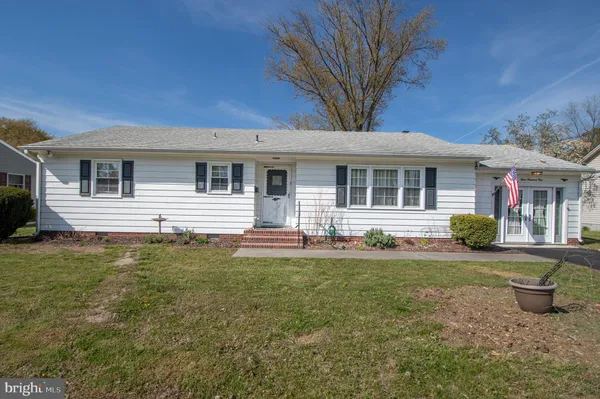 a front view of a house with swimming pool