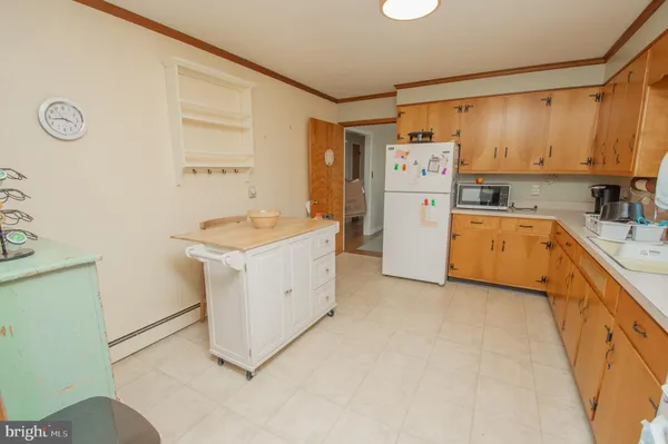 a utility room with cabinets washer and dryer