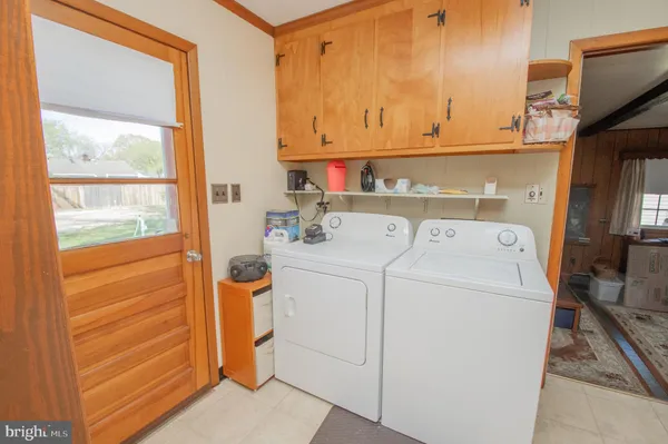 a utility room with dryer and washer