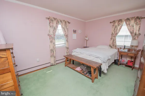 a room with a bed and a window