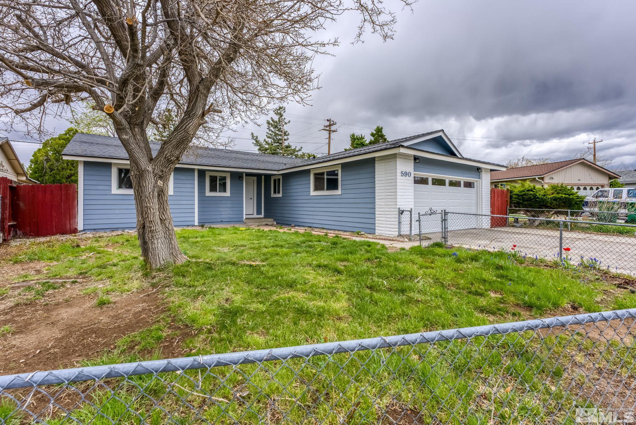 590 Nancy Circle Reno, NV 89503 - Photo 3 of 28 a front view of a house with garden