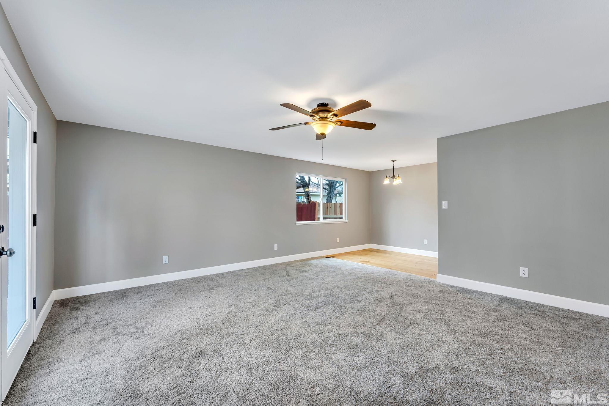 590 Nancy Circle Reno, NV 89503 - Photo 9 of 28 an empty room with a ceiling fan and a window