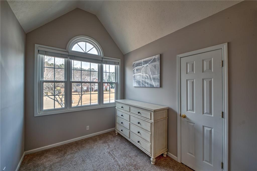2234 Oak Falls Lane Buford, GA 30519 - Photo 12 of 23 a view of a livingroom with a window