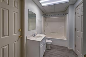 2234 Oak Falls Lane Buford, GA 30519 - Photo 20 of 23 a bathroom with a granite countertop sink toilet and shower