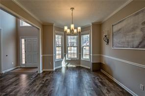 2234 Oak Falls Lane Buford, GA 30519 - Photo 4 of 23 a view of a room with wooden floor and large window