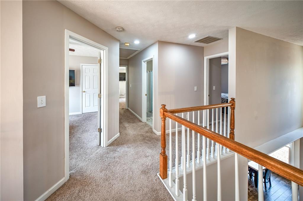 2234 Oak Falls Lane Buford, GA 30519 - Photo 9 of 23 a view of a hallway with wooden floor and entryway