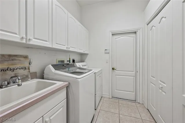 a kitchen with a sink cabinets and utility