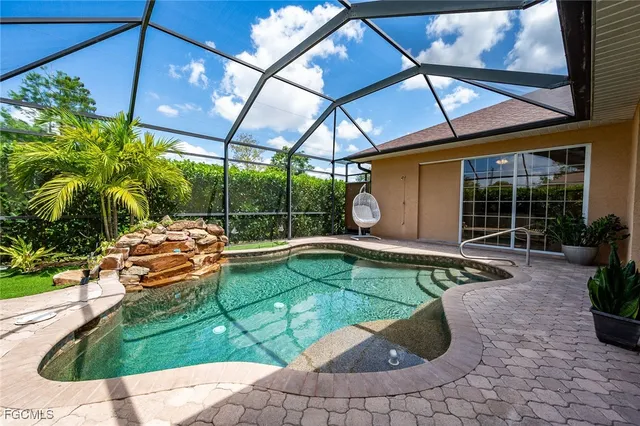 a view of a swimming pool with a patio