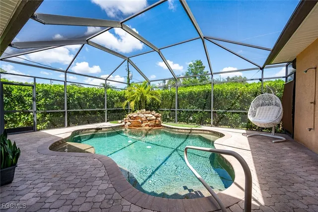 a view of a backyard with sitting area and furniture