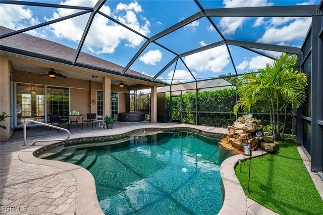 a view of a swimming pool with a patio