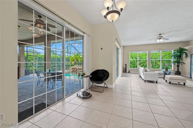 a view of a livingroom with furniture and large windows