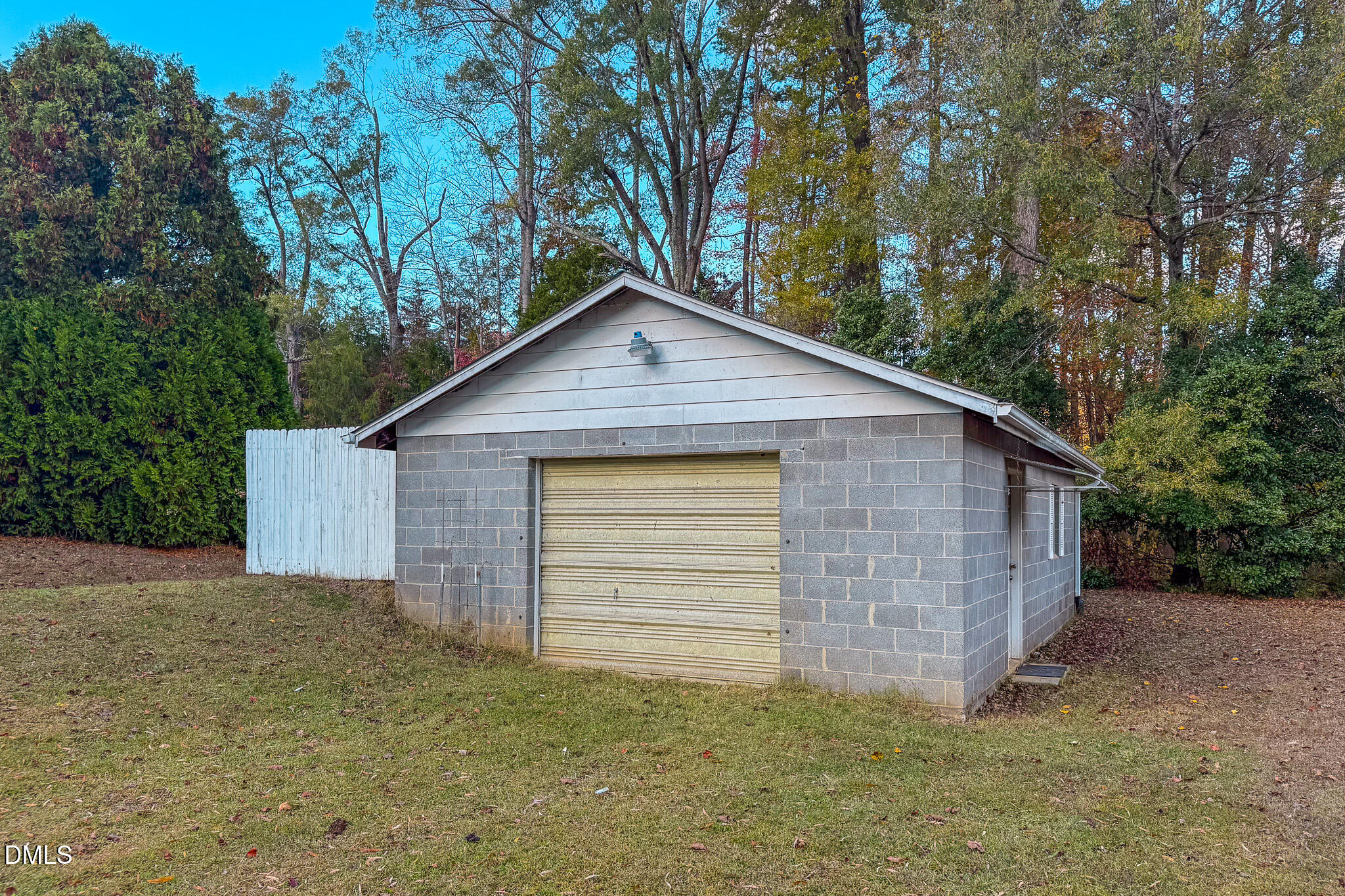 7270 Durham Road Timberlake, NC 27583 - Photo 12 of 33 a view of a small house with a large window and large tree