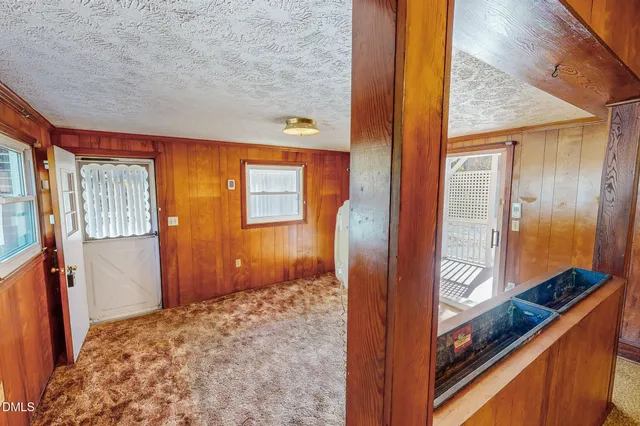 a kitchen with stainless steel appliances granite countertop a refrigerator a sink and dishwasher