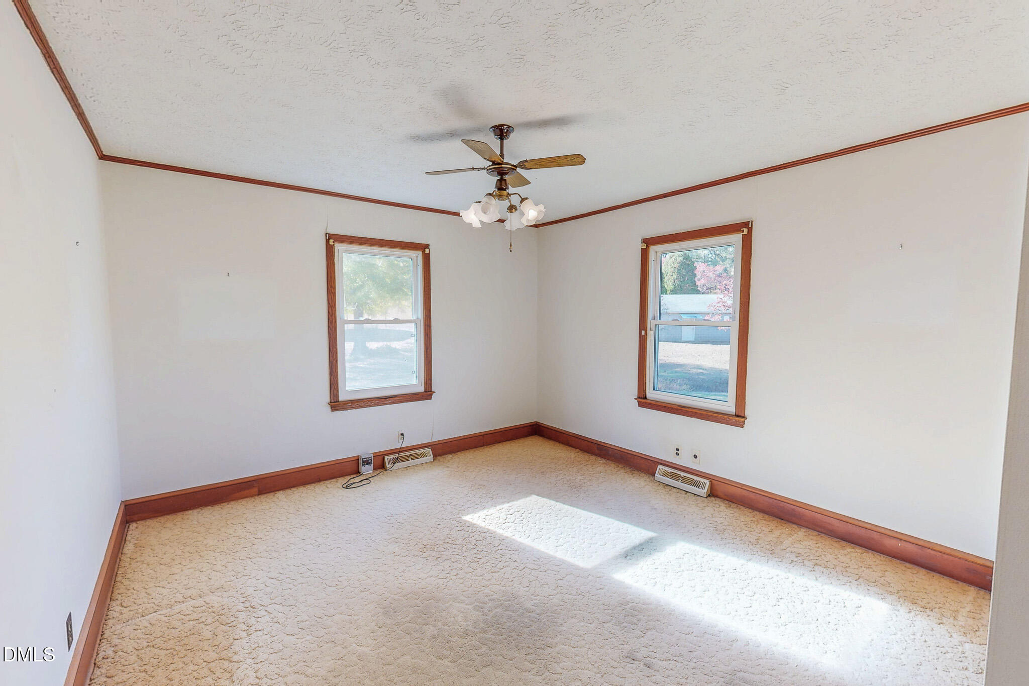 7270 Durham Road Timberlake, NC 27583 - Photo 21 of 33 an empty room with windows and fan