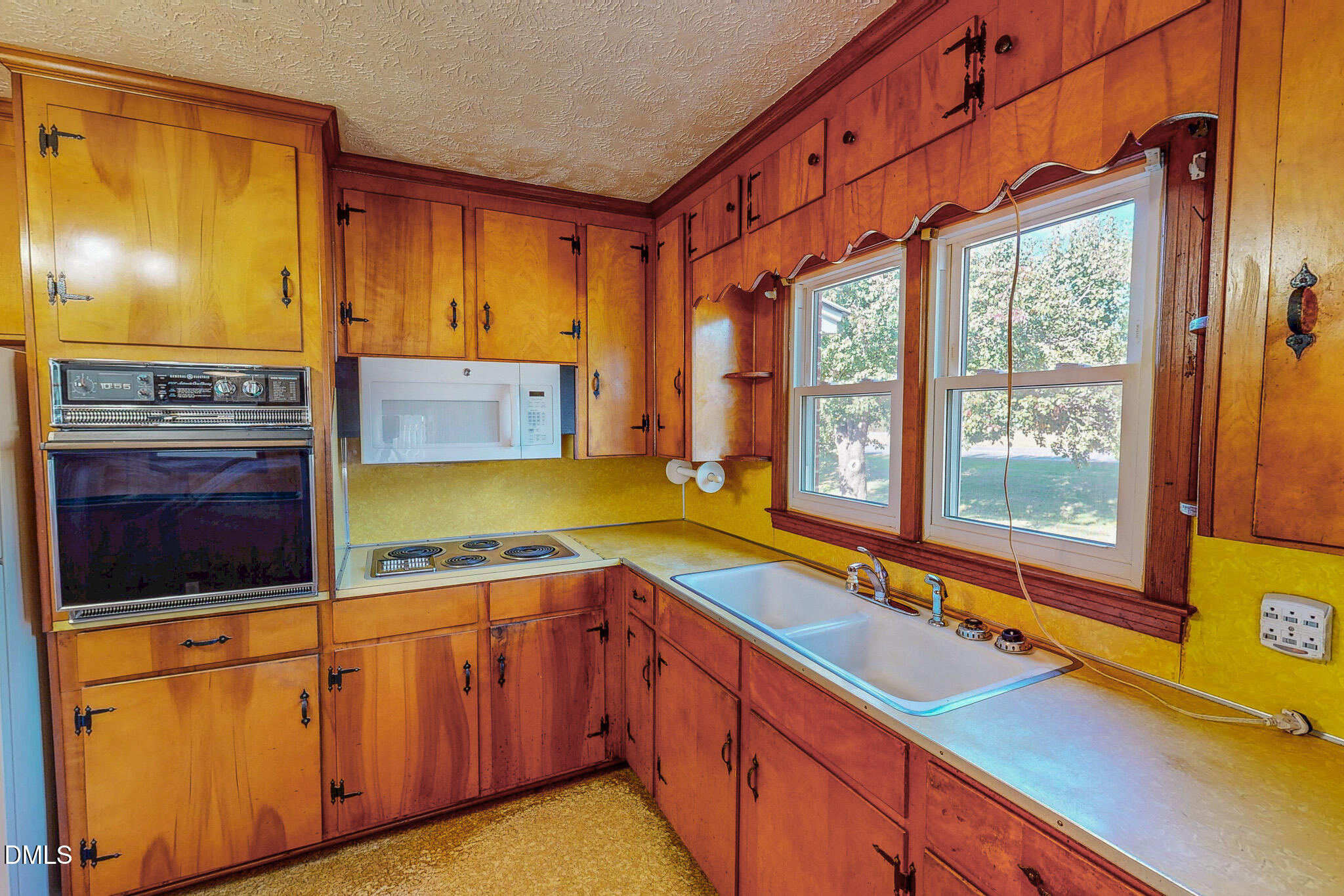 7270 Durham Road Timberlake, NC 27583 - Photo 28 of 33 a kitchen with stainless steel appliances a sink and cabinets