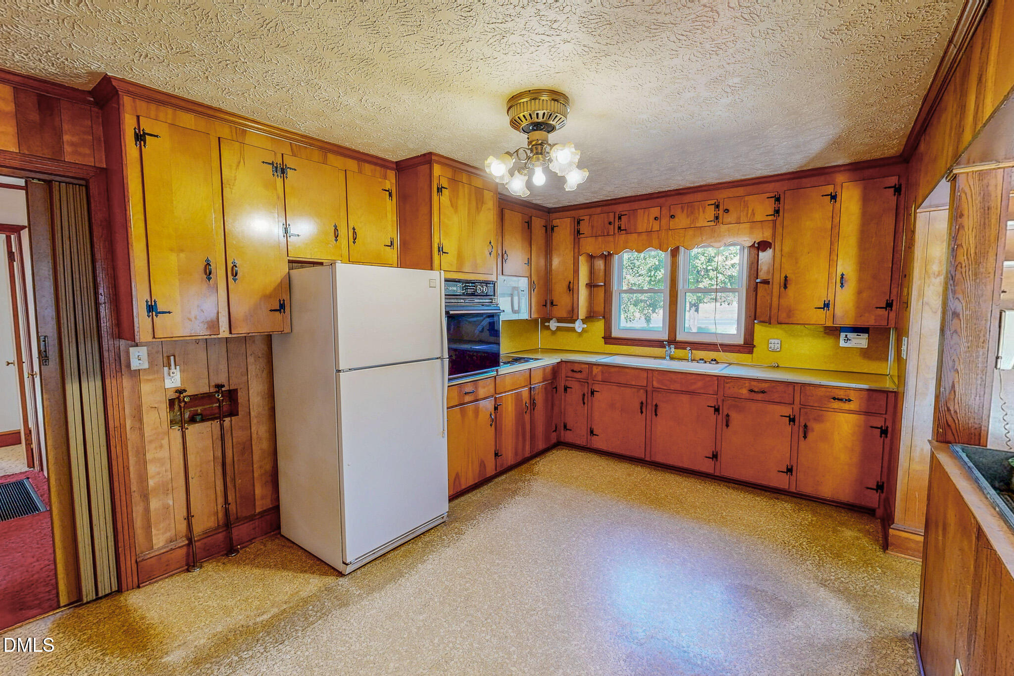 7270 Durham Road Timberlake, NC 27583 - Photo 3 of 33 a kitchen with sink refrigerator and cabinets