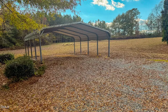 a backyard of a house with lots of green space