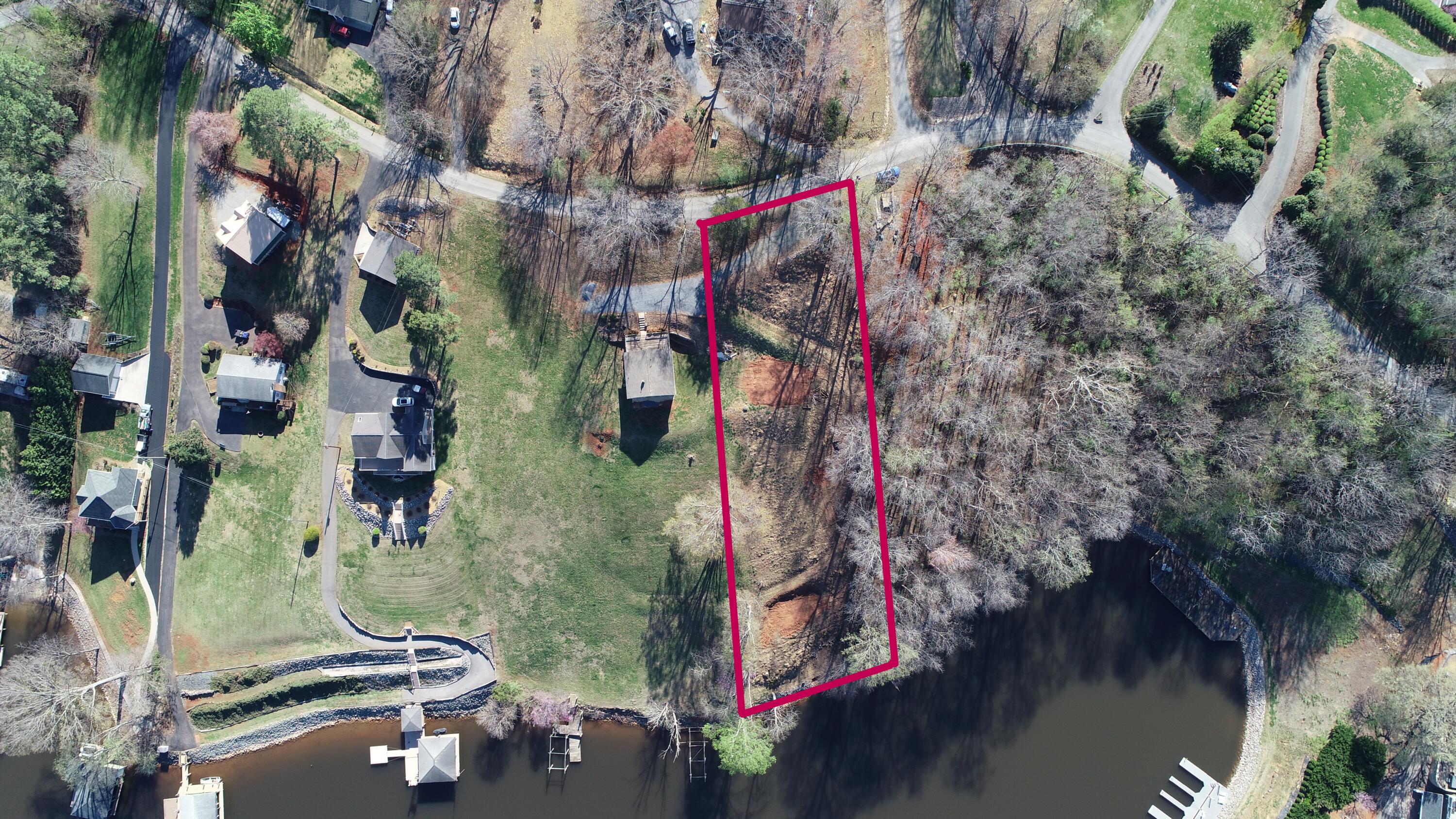6686 Horseshoe Bend Road Goodview, VA 24095 - Photo 2 of 7 an aerial view of residential house with outdoor space and lake view