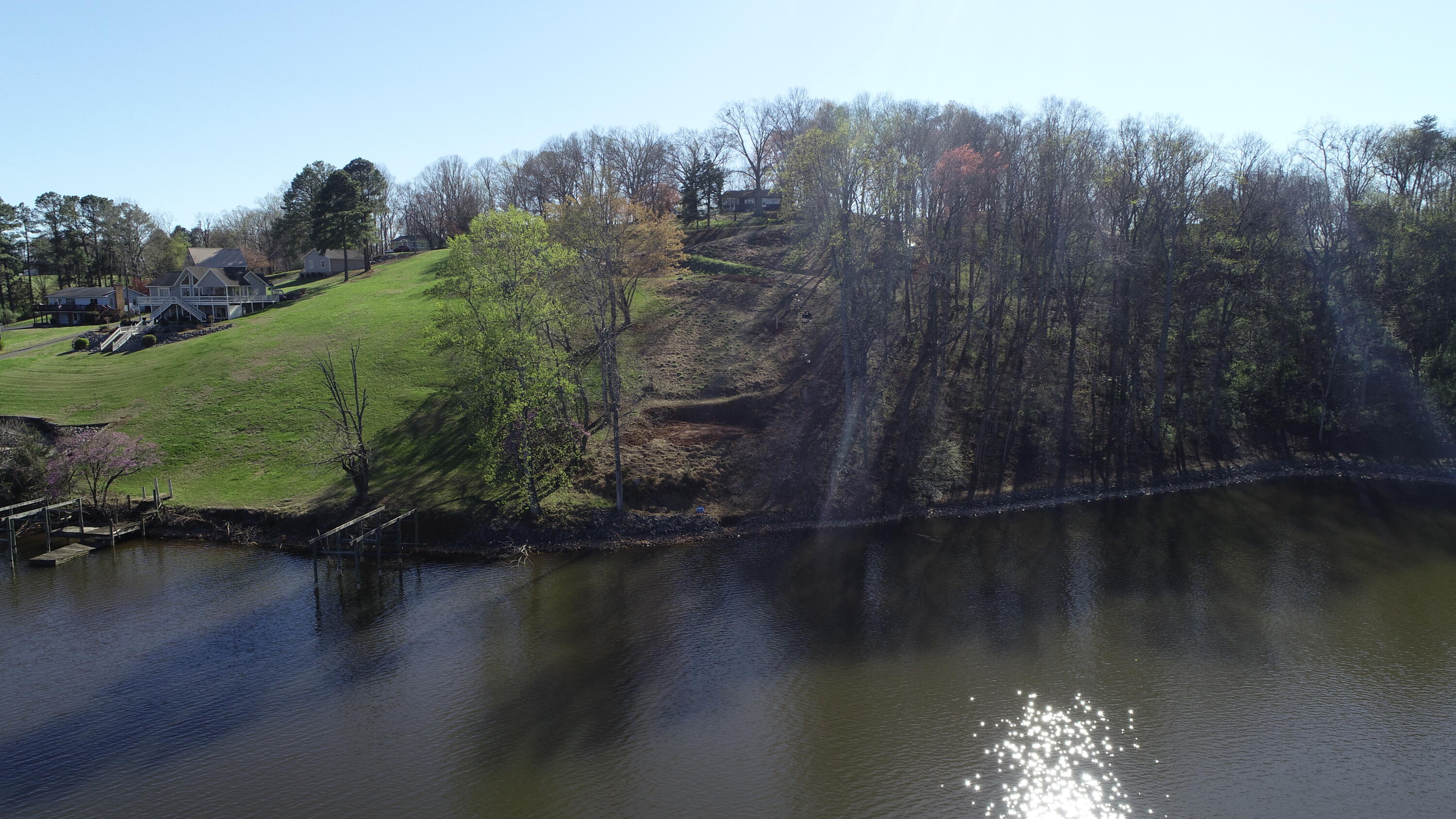 6686 Horseshoe Bend Road Goodview, VA 24095 - Photo 7 of 7 a view of a lake with a yard