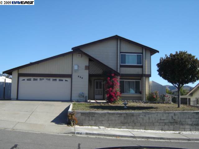 884 Windward Drive Rodeo, CA 94572 - Photo 1 of 1 a front view of house with garage