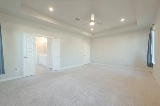 a spacious bathroom with a bathtub shower sink and mirror