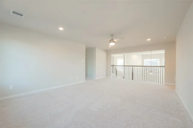 an empty room with an outdoor view and a window