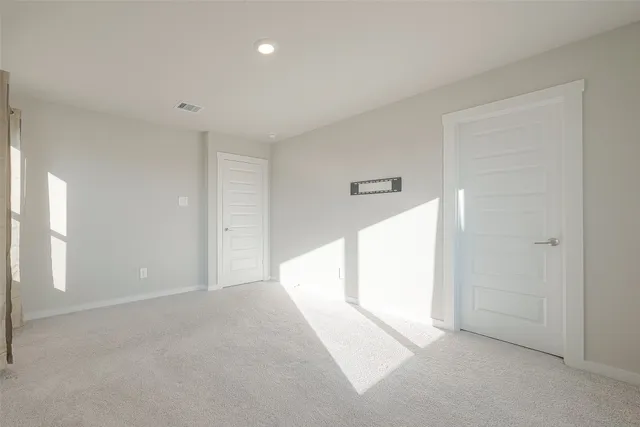 an empty room with a empty space and a window