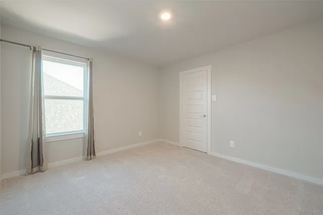 an empty room with closet area