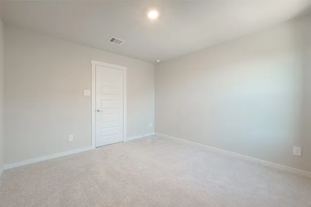 an empty room with an empty space and a window