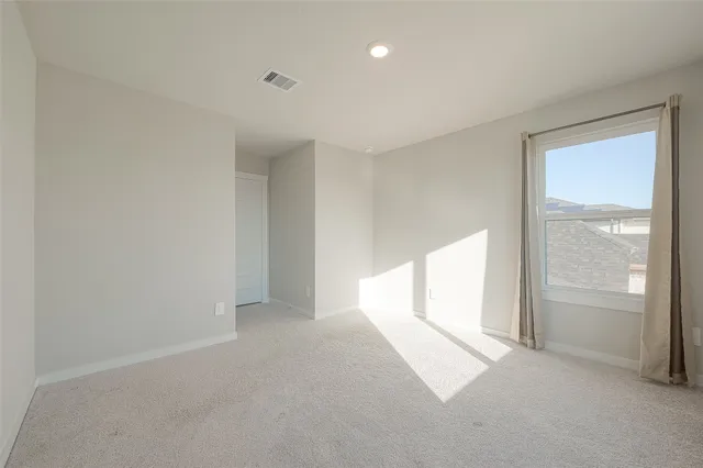 a bathroom with a bathtub shower sink vanity and toilet