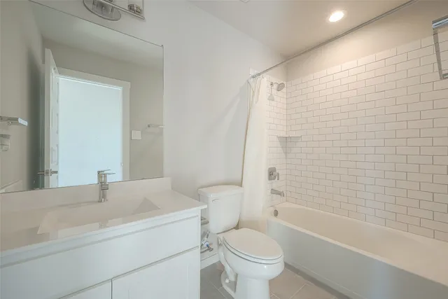 a bathroom with a sink a shower and a mirror